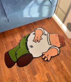 a rug with a cartoon character laying on the floor