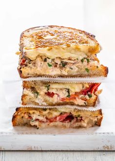 three grilled sandwiches stacked on top of each other