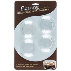 three glass tealight holders in white packaging