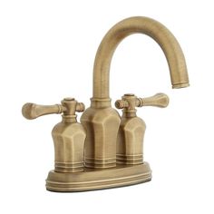 an antique brass faucet with three handles