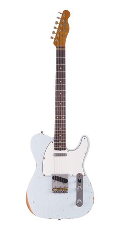 an electric guitar sitting on top of a white surface