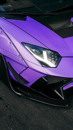 the front end of a purple sports car