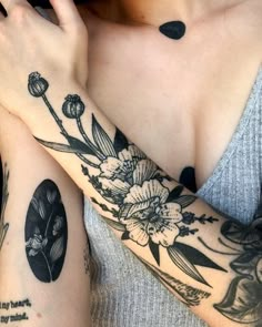 two women with matching tattoos on their arms