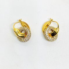 These highly coveted earrings are the perfect size. They are beautiful and so sparkly signed Celine. They are in pristine condition and can be worn with or without the second rhinestone ring. The gold hoops by themselves are a classic and comfortable look for daytime. Going out to dinner after a long day simply add the sparkly second ring and now you've got a classy and elegant evening look with sparkle that catches everyone's adoration.     These are 18k yellow gold HEAVILY plated no sign of we Luxury Yellow Gold Channel Set Earrings, Paris Runway, Celine Earrings, Vintage Celine, Gift Wrap Box, Gold Sign, Beautiful Gift Wrapping, Rhinestone Ring, Earrings Vintage