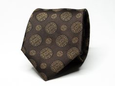 Elevate your ensemble with timeless charm wearing this distinguished brown tie embellished with a sophisticated medallion pattern. Size: 8cm wide (3.15in) Color: Brown Pattern: Medallion These neckties are dry clean only. Our shop has a huge selection of ties, pocket squares, cufflinks and other suit accessories. For more of our suit accessories, please visit our shop: https://www.etsy.com/ca/shop/GentlemensEra If you have any questions or concerns, please contact us and we will be able to assis Classic Brown Suit And Tie Accessories For Wedding, Classic Brown Suit Accessories For Wedding, Classic Brown Wedding Suit And Tie Accessories, Classic Brown Ties For Wedding, Elegant Formal Brown Suit And Tie Accessories, Elegant Brown Suit And Tie Accessories For Semi-formal Occasions, Classic Brown Wedding Ties, Formal Brown Suit And Tie Accessories, Luxury Brown Suit And Tie Accessories For Business