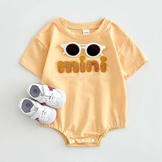 Your little one will be the cutest mini in town with this adorable 'Mini' Short Sleeve Onesie! 🤩 This comfy cotton onesie features a playful 'Mini' letter print, perfect for your baby to wear all summer long. ☀️ The breathable fabric and relaxed fit will keep them cool and comfy, whether they're crawling around the house or playing at the park. 👶 #summerfashion #babyclothes #minionesie Specifications: Gender: Unisex Age Range: 1-18 months Style: Cute Pattern Type: Letter Season: Summer Materia Mini Romper, Cotton Romper, Romper Outfit, Girls Blouse, Boys Set, Mini Short, Family Moments, Toddler Girl Dresses, Boys Top