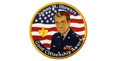 a patch with the image of a man in uniform and an american flag behind it