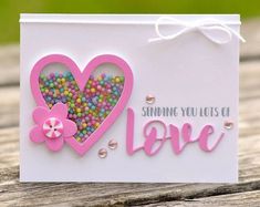 a card that says sending you lots of love with candy in the shape of a heart