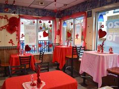 the inside of a restaurant decorated for valentine's day