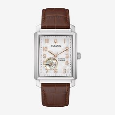 The new Sutton Automatic from Bulova introduces a fresh new shape to this classic watch. Inspired by the 1948 President style, the rectangular stainless steel case has a silver-white face with rose gold-tone accents, with a subtle texture and an open aperture to view the balance wheel of the movement. The case back features a mineral crystal exhibition window, to showcase the automatic movement powering this luxury watch. The case is paired with a rich brown alligator-grain leather strap for an elegant style. For anyone seeking a classic timepiece with a distinct personality, this is a piece that can't be overlooked.Number of Batteries: 1Features: Quick ShipJewelry Closure: BucklePower Source: AutomaticWatch Movement: AutomaticWater Resistance: 30mBand Color: BrownDial Color: Silver ToneMe Omega Speedmaster Professional, Tag Heuer Monaco, Brown Leather Strap Watch, Bulova Watches, Speedmaster Professional, Seiko 5 Sports, Custard Cake, Brown Watches, Seiko 5