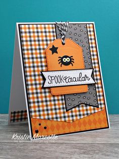 an orange and black card with a tag on it that says spook kawaier