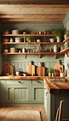 a kitchen with green cabinets and wooden shelves filled with pots, pans, and other cooking utensils