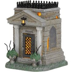 an outdoor halloween decoration with a lighted door