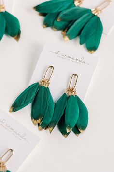 New for Fall and Holiday 2023, we present the newest addition to our feather family! Our hand-selected emerald green feathers are dipped in gold accent then combined with gold hardware for a touch of stunning glamour! The lightweight design ensures comfortable wear while the approximately 2.5-inch length adds an elegant touch! Green Feather Earrings As A Gift, Dipped Feathers, Green Feathers, Fun Arts And Crafts, Marco Island, Accessories Jewelry Earrings, Gold Dipped, Home Candles, Gold Accent