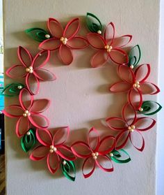 a paper flower wreath hanging on the wall