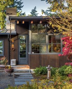 a house that is surrounded by trees and plants