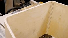 a piece of plywood being worked on in a shop