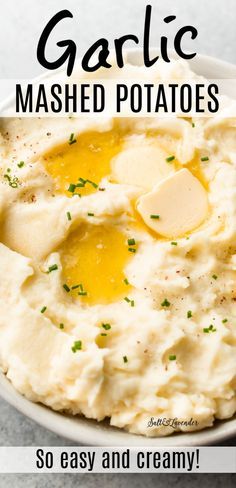 garlic mashed potatoes in a white bowl with butter on top