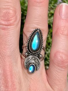 Here is one of a kind Moon Crescent ring! This double band ring features a beautiful Labradorite and tiny Moonstone.  The moon is made in Fine Silver, while everything else is done in Sterling Silver.  Stamped .925 on the back side.  Size 6. *Free USPS Priority Shipping within the U.S.  Please message me if you're interested in purchasing and live outside of the United States - I will find the additional shipping cost. Thank you very much for your interest in my work * Whether for yourself or as a gift to a loved one, I create each piece with care in hopes that it may be treasured by its new owner.  Please note, due to the nature of hand crafted jewelry, there might be minor imperfections caused by my tools.   * Sterling Silver will naturally tarnish over time.  To help prevent tarnishing, Bohemian Sterling Silver Moonstone Open Ring, Adjustable Mystical Labradorite Rings, Mystical Labradorite Ring Jewelry, Unique Moonstone Ring With Moon Phase, Adjustable Moon Shaped Bohemian Rings, Bohemian Adjustable Moon-shaped Rings, Bohemian Moon Shaped Adjustable Rings, Bohemian Moonstone Ring With Moon Phase Detail, Bohemian Open Ring With Moon Phase Detail