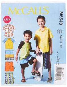 two young boys standing next to each other in front of an advertisement for their clothing