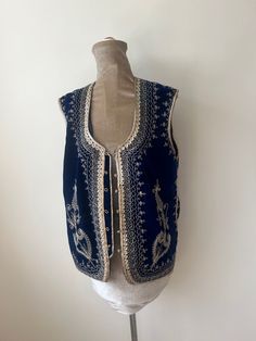 A vintage blue velvet ottoman waistcoat with gold embroidery. There is some fading to the lining, but this can't be seen when worn. UK Size 14. Please check measurements: Chest - 102cm Waist - 102cm Length - 63cm Elegant Embroidered Festive Vest, Blue Velvet Ottoman, Embroidered Waistcoat, Velvet Ottoman, Gold Embroidery, Vest Outfits, September 2024, Vintage Velvet, Blue Velvet