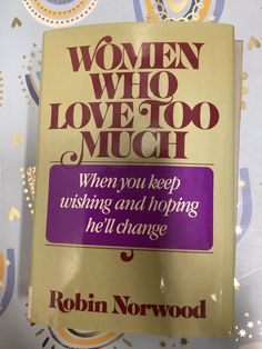 a book with the title women who love too much written in purple and gold on it