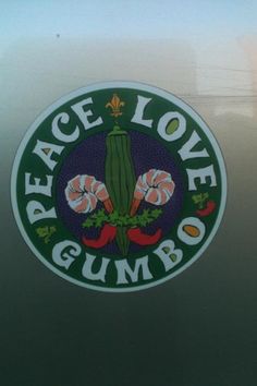 the peace love gumbo sticker is shown in green and purple with flowers on it