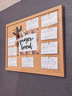 a bulletin board that has some writing on it with flowers and leaves attached to it