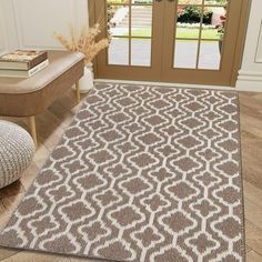 a brown and white rug in front of a door