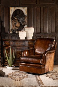 a horse head is mounted on the wall above a chair in a room with wood paneling