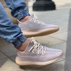 Through the Yeezy Boost 350 V2 'Synth Non-Reflective,' Kanye West continues the 350 V2's legacy, which began in 2016. This model was offered as a regional-exclusive release, made available to customers only in Africa, Asia and Australia. The shoe incorporates a flexible Primeknit upper with a semi-translucent window at the lateral, dropping the heel tab usually associated with the style. Full-length adidas Boost is encapsulated by a TPU midsole cage, underscored by gum rubber tread. Adidas Shoes Superstar, Jordan Yeezy, Mens Yeezy, Adidas Shoes Mens, Superstars Shoes, 40 Women, Adidas Boost, Yeezy Boost 350 V2, Yeezy 350