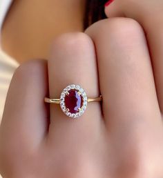 Ruby Gold Ring - Natural Ruby Gemstone Gold Ring - Dainty Gold Jewelry - Ruby Women Promise ring - Gift For Wife - Solitaire Ruby Ring *100% natural gemstone *14k solid gold *solid gold (NOT plated) *gemstone: ruby *gemstone: zircon *stone shape ruby: oval *stone shape zircon: round *stone ruby : 5x7 mm. *stone ruby ct. : 1.00-1.20 ct. *stones ruby : 1 pc. *stone zircon : 20 pcs. Dazzling Oval Ruby Ring With Halo Setting, Gia Certified Oval Ruby Ring For Wedding, Yellow Gold Ruby Ring With Halo Cluster Setting, Gia Certified Round Cut Ruby Ring Fine Jewelry, Gia Certified Round Cut Ruby Ring, Ruby Rings With Halo Design And Round Cut, Ruby Rings With Halo Design, Ruby Ring With Halo Design And Round Cut, Ruby Ring With Halo Design In Round Cut