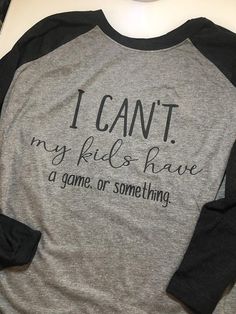 Sports Mom - I Can't My Kids Have Practice - Funny Mom Shirt - Game Day Shirt - Football Mom Shirt - Gray Team Spirit Cotton Top, Gray Cotton Team Spirit Top, Gray Team Spirit Top With Letter Print, Black Tops With Team Spirit Lettering, Gray Tops With Text Print For Game Day, Cotton Slogan Tops For Game Day, Funny Cotton Sports Tops, Pre-shrunk Cotton Tops In Athletic Heather, Relaxed Fit Athletic Heather Top With Letter Print