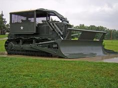 a large bulldozer is parked in the mud