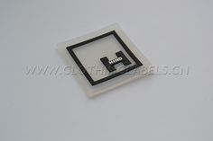 a white and black square shaped object on top of a table