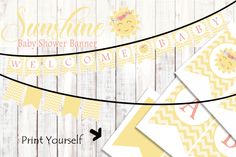 a baby shower banner with yellow chevrons and pink flowers on the top, next to an arrow