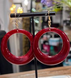 Dangle Earrings in Wine Chic Circle Jewelry For Party, Trendy Party Earrings With Ear Wire, Trendy Red Circular Jewelry, Chic Hypoallergenic Jewelry For Parties, Trendy Evening Drop Earrings, Trendy Circle Earrings With Ear Wire, Chic Round Party Earrings, Chic Party Earrings With Ear Wire, Elegant Red Hoop Earrings With Ear Wire