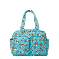 a blue purse with flowers on the front and shoulder straps, sitting against a white background