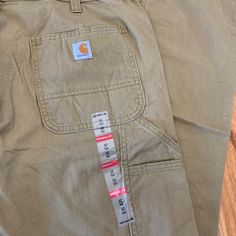 The Women's Original Fit Crawford Pant By Carhartt. Size 12 Tall. Measurements Approx: 14.5" Rise 17" Across Waist 33.5" Inseam Color Is Tan Carhartt Carpenter Jeans, Womens Carhartt, Carhartt Cargo Pants, Carhartt Scrubs, Carhartt Jeans, Painters Pants, Carhartt Womens, Carhartt Pants, Vintage Carhartt