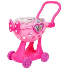 a pink toy stroller with hearts on it