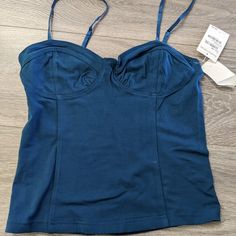 New With Tag. Size Xl: Armpit-To-Armpit 15in, Waist-To-Waist 14in, Bottom Left-To-Right 15in, Length 12 In Size L: Armpit-To-Armpit 14in, Waist-To-Waist 13in, Bottom Left-To-Right 14in, Length 12 In Size M: Armpit-To-Armpit 13in, Waist-To-Waist 11in, Bottom Left-To-Right 13in, Length 12 In Size S: Armpit-To-Armpit 12in, Waist-To-Waist 10.5in, Bottom Left-To-Right 12in, Length 11 In Fitted Solid Tops With Removable Bra Pads, Blue Bra-friendly Camisole Crop Top, Blue Cami Crop Top With Adjustable Straps, Blue Spaghetti Strap Crop Top, Bra-friendly, Blue Cami Crop Top Bra Friendly, Blue Cami Crop Top, Bra Friendly, Blue Camisole Crop Top With Built-in Bra, Blue Bra-friendly Camisole Top, Fitted Blue Crop Top Tube Top