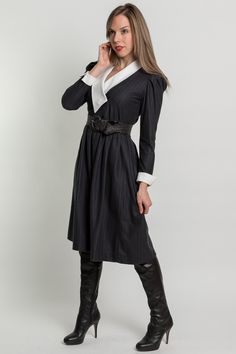 "This little dress has a contrasting white lapel collar that crosses over with three buttons. The sleeves are long with cuffs that fold up. The waist is elastic and the skirt has pockets at the hips. The dress is very soft similar to flannel and the collar/cuffs are made of a snaggy woven material.  { d e t a i l s } c o l o r : charcoal grey and white m a t e r i a l : poly blend m a k e r : Act I size on tag: 6 best fit for size: small { c o n d i t i o n }  excellent { m e a s u r e m e n t s Fitted V-neck Midi Dress With Button Cuffs, Fitted Belted Dress With Lapel Collar, Semi-formal Fall Dress With Lapel Collar, Fitted Dress With Lapel Collar For Office, Fitted Belted Long Sleeve Dress For Work, Fitted Long Sleeve Belted Dress For Work, Fall Dresses With Cuffed Sleeves, Formal Long Sleeve Midi Dress With Fitted Waist, Fitted Dress With Lapel Collar And Buttons