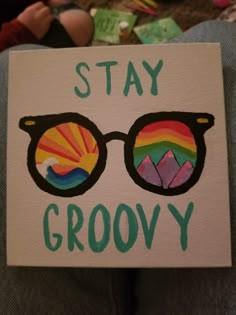 a sign that says stay grooy with sunglasses on it