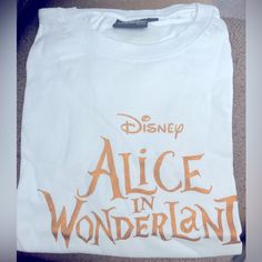 Disney’s Alice In Wonderland T-Shirt Brand New, Never Worn. Xl Alice In Wonderland Tshirt Ideas, Alice In Wonderland Graphic, Tshirt Ideas, Gold Lettering, Disney S, T Shirt Brand, Gold Letters, Shirt Brand, Sweatshirt Designs