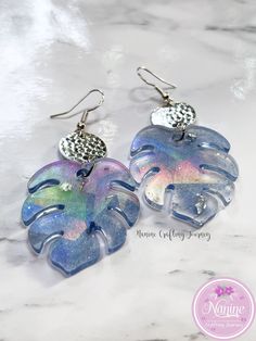 the earrings are made out of glass and silver