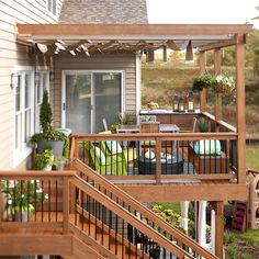 an outdoor deck with stairs and patio furniture