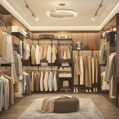 a walk in closet filled with lots of clothes and shoes on shelves next to a white rug