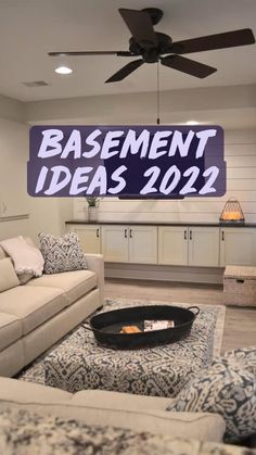 a living room filled with furniture and a sign that says basement ideas 2012 on the wall