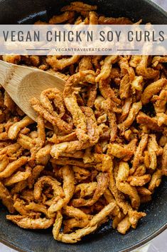 vegan chicken soy curls in a skillet with a wooden spoon and text overlay