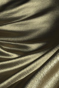 the fabric is shiny and gold in color